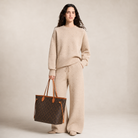 Luxury Beige Knit Sweater and Wide Leg Pants Set Styled with a Louis Vuitton Monogram Neverfull GM